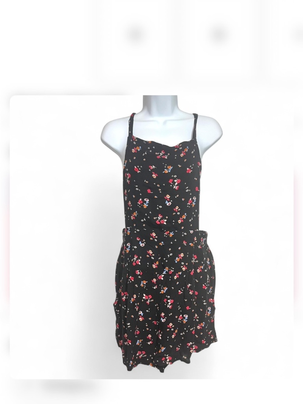 Free People "Sweet in the Streets" black floral print romper Size Large Backless